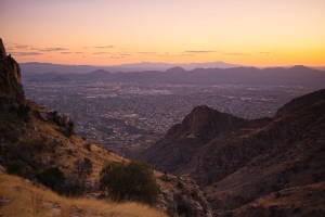 View of Tucson from a hiking trail at sunset